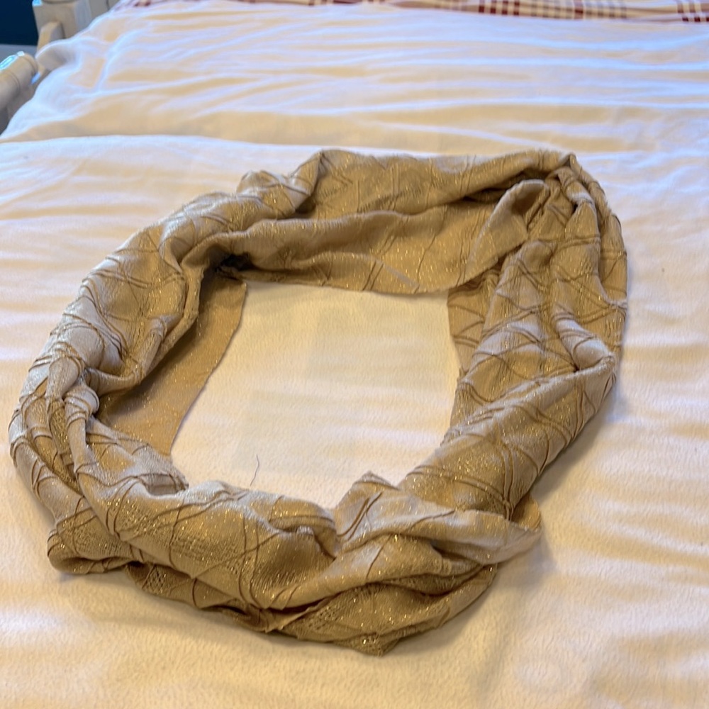 Croft and Borrow infinity scarf, tan with gold thread running through it.